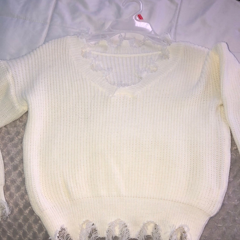 White ripped sweater